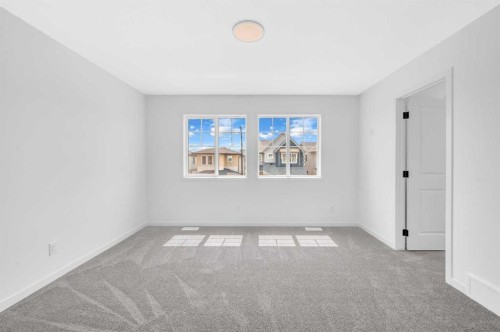 32 Rowmont Common Nw, Calgary, AB - Indoor Photo Showing Other Room
