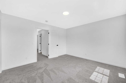 32 Rowmont Common Nw, Calgary, AB - Indoor Photo Showing Other Room