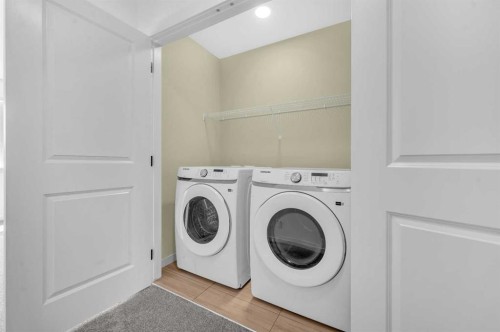 32 Rowmont Common Nw, Calgary, AB - Indoor Photo Showing Laundry Room