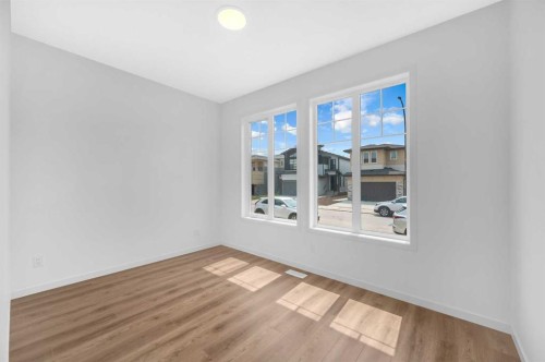 32 Rowmont Common Nw, Calgary, AB - Indoor Photo Showing Other Room