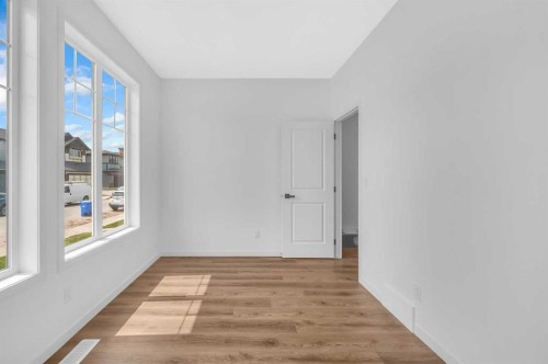 32 Rowmont Common Nw, Calgary, AB - Indoor Photo Showing Other Room