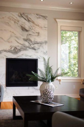 57 Slopes Point Sw, Calgary, AB - Indoor With Fireplace