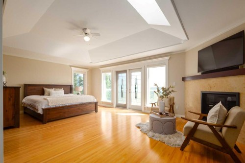 57 Slopes Point Sw, Calgary, AB - Indoor With Fireplace