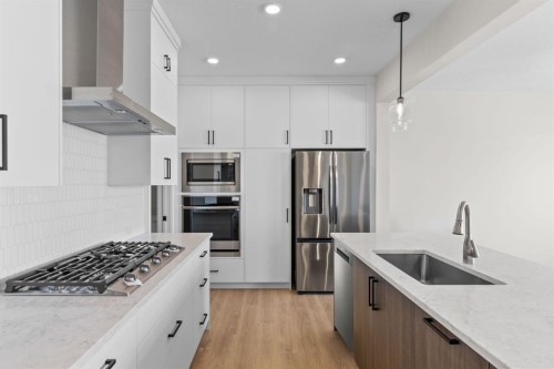 4067 Sawgrass Street Nw, Airdrie, AB - Indoor Photo Showing Kitchen With Upgraded Kitchen