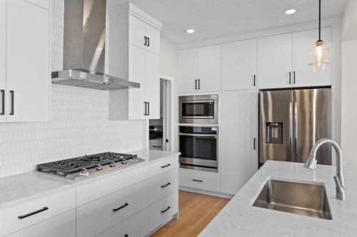 4067 Sawgrass Street Nw, Airdrie, AB - Indoor Photo Showing Kitchen With Upgraded Kitchen