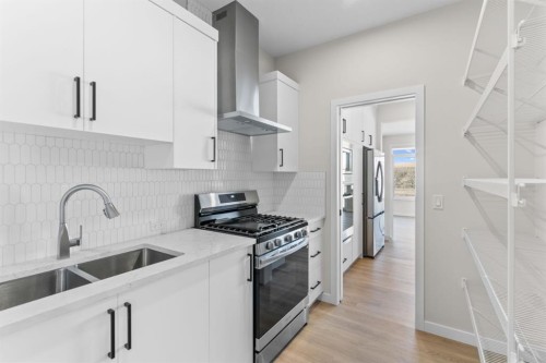 4067 Sawgrass Street Nw, Airdrie, AB - Indoor Photo Showing Kitchen With Double Sink With Upgraded Kitchen