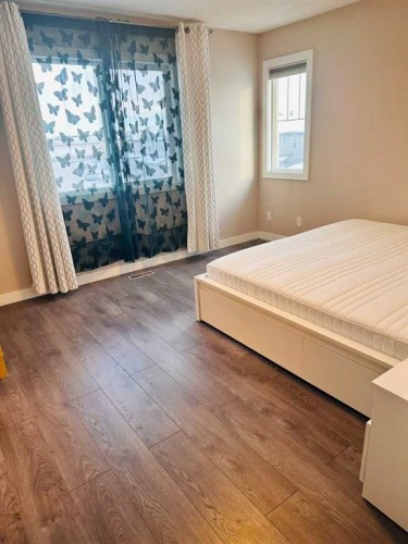 225 Panatella Square Nw, Calgary, AB - Indoor Photo Showing Bedroom