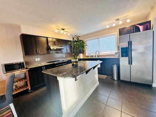 225 Panatella Square Nw, Calgary, AB - Indoor Photo Showing Kitchen With Upgraded Kitchen
