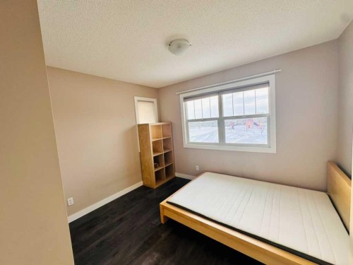 225 Panatella Square Nw, Calgary, AB - Indoor Photo Showing Bedroom