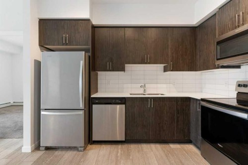 3405-3727 Sage Hill Drive Nw, Calgary, AB - Indoor Photo Showing Kitchen With Stainless Steel Kitchen With Double Sink