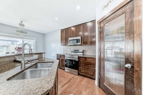 104 Panamount Terrace Nw, Calgary, AB - Indoor Photo Showing Kitchen With Stainless Steel Kitchen With Double Sink With Upgraded Kitchen