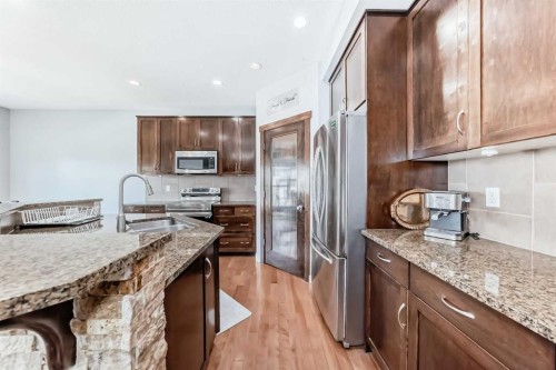 104 Panamount Terrace Nw, Calgary, AB - Indoor Photo Showing Kitchen With Stainless Steel Kitchen With Double Sink With Upgraded Kitchen
