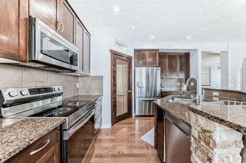 104 Panamount Terrace Nw, Calgary, AB - Indoor Photo Showing Kitchen With Stainless Steel Kitchen With Double Sink With Upgraded Kitchen