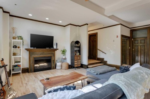 1-804 18 Avenue Sw, Calgary, AB - Indoor Photo Showing Living Room With Fireplace