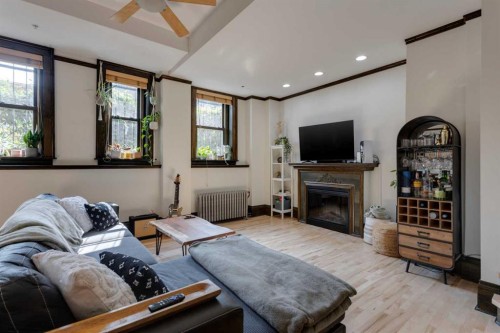 1-804 18 Avenue Sw, Calgary, AB - Indoor Photo Showing Living Room With Fireplace