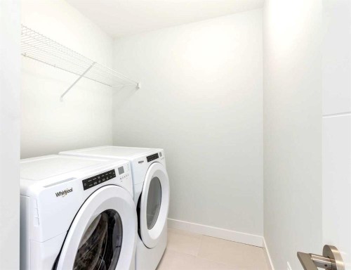 1157 Iron Ridge Avenue, Crossfield, AB - Indoor Photo Showing Laundry Room
