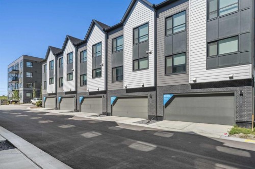 408-20295 Seton Way Se, Calgary, AB - Outdoor With Facade