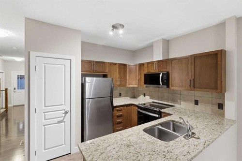 71 Panatella Hill Nw, Calgary, AB - Indoor Photo Showing Kitchen With Double Sink