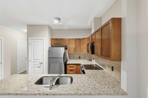 71 Panatella Hill Nw, Calgary, AB - Indoor Photo Showing Kitchen With Double Sink