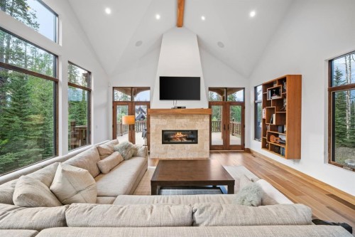 118 Cairns Landing, Canmore, AB - Indoor Photo Showing Living Room With Fireplace