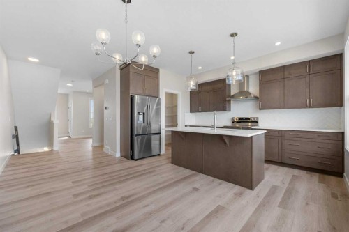 121 Wild Rose Way Se, Calgary, AB - Indoor Photo Showing Kitchen With Upgraded Kitchen