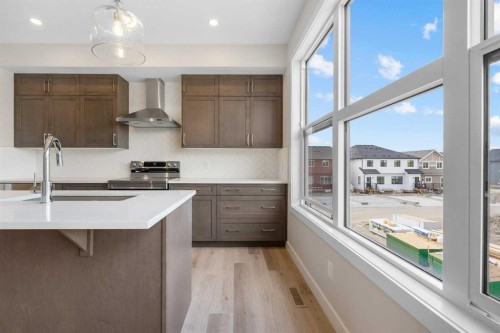 121 Wild Rose Way Se, Calgary, AB - Indoor Photo Showing Kitchen With Upgraded Kitchen