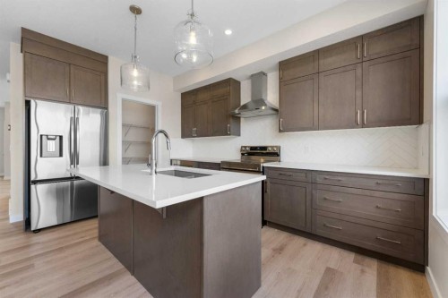 121 Wild Rose Way Se, Calgary, AB - Indoor Photo Showing Kitchen With Upgraded Kitchen