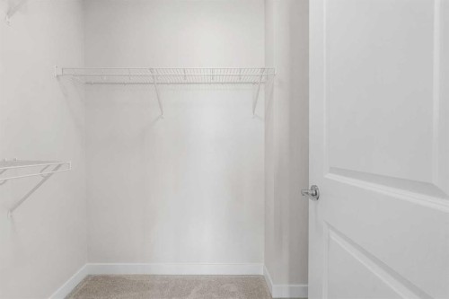 121 Wild Rose Way Se, Calgary, AB - Indoor With Storage
