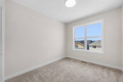 121 Wild Rose Way Se, Calgary, AB - Indoor Photo Showing Other Room