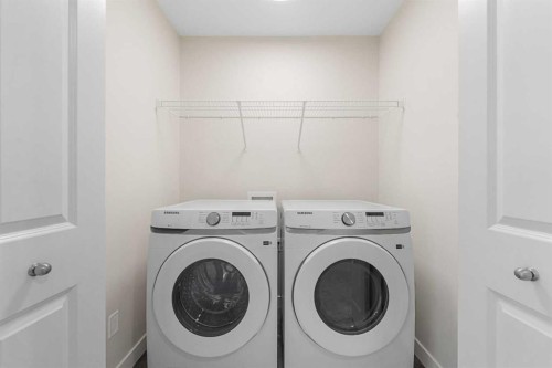 121 Wild Rose Way Se, Calgary, AB - Indoor Photo Showing Laundry Room