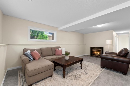 7136 Laguna Way Ne, Calgary, AB - Indoor Photo Showing Living Room With Fireplace