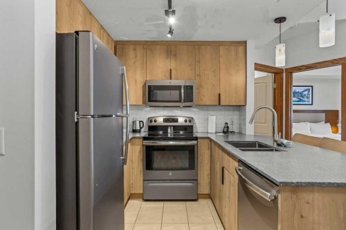 109-190 Kananaskis Way, Canmore, AB - Indoor Photo Showing Kitchen With Double Sink
