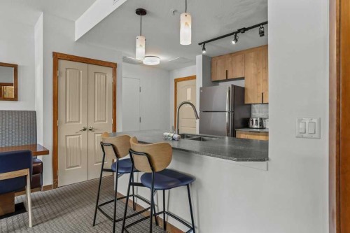 109-190 Kananaskis Way, Canmore, AB - Indoor Photo Showing Kitchen With Double Sink
