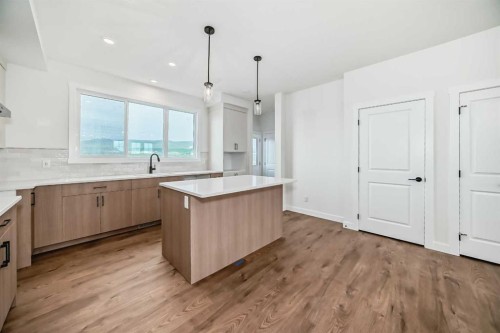 426 Heartland Way, Cochrane, AB - Indoor Photo Showing Kitchen With Upgraded Kitchen