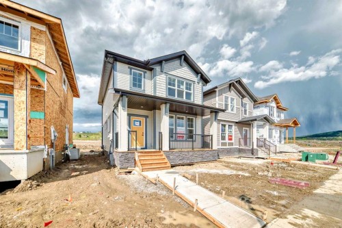 426 Heartland Way, Cochrane, AB - Outdoor With Facade