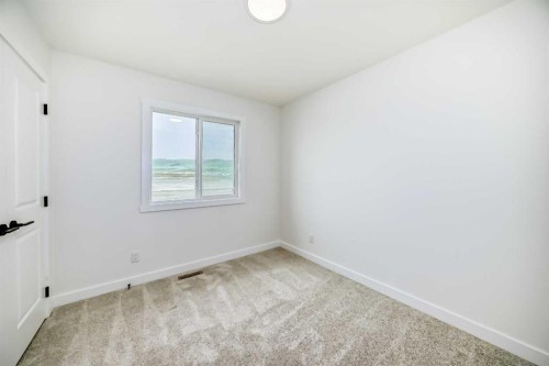 426 Heartland Way, Cochrane, AB - Indoor Photo Showing Other Room