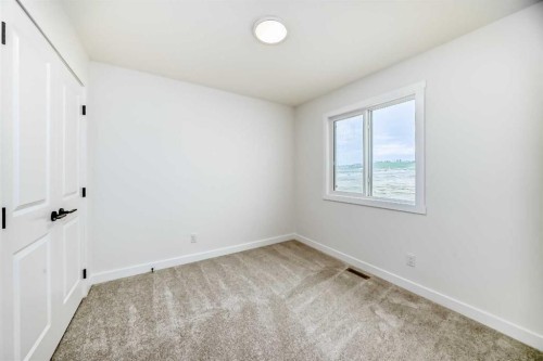 426 Heartland Way, Cochrane, AB - Indoor Photo Showing Other Room