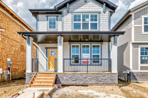 426 Heartland Way, Cochrane, AB - Outdoor With Deck Patio Veranda With Facade