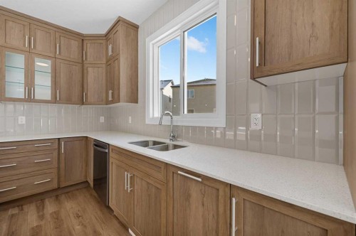 1059 Southwinds Green Sw, Airdrie, AB - Indoor Photo Showing Kitchen With Double Sink