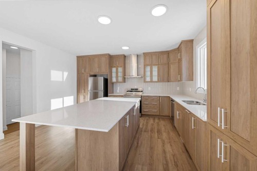 1059 Southwinds Green Sw, Airdrie, AB - Indoor Photo Showing Kitchen With Stainless Steel Kitchen With Double Sink