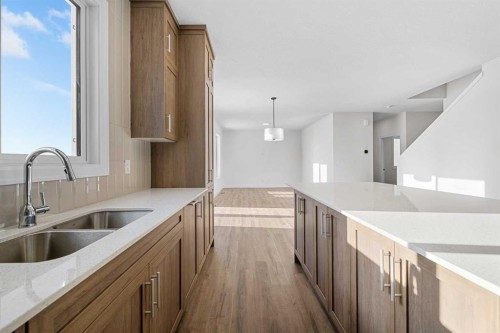 1059 Southwinds Green Sw, Airdrie, AB - Indoor Photo Showing Kitchen With Double Sink