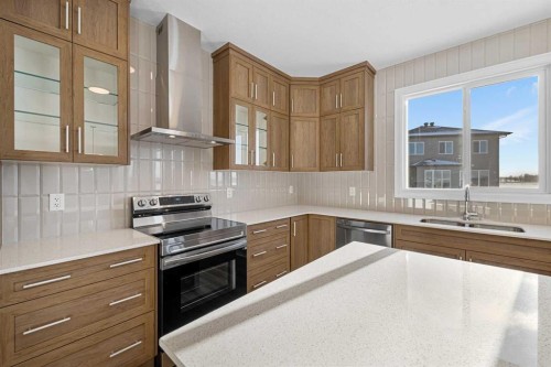 1059 Southwinds Green Sw, Airdrie, AB - Indoor Photo Showing Kitchen With Double Sink