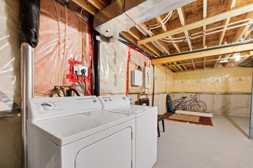 90 Panatella Villas Nw, Calgary, AB - Indoor Photo Showing Laundry Room