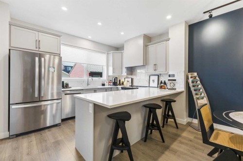 63 Heirloom Boulevard Se, Calgary, AB - Indoor Photo Showing Kitchen With Stainless Steel Kitchen With Upgraded Kitchen