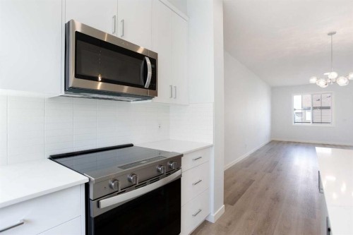 406-1750 Rangeview Drive Se, Calgary, AB - Indoor Photo Showing Kitchen