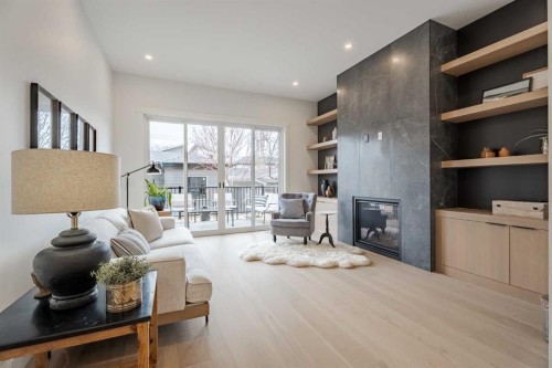2510 17 Street Nw, Calgary, AB - Indoor Photo Showing Living Room With Fireplace