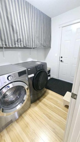 1156 Sherwood Boulevard Nw, Calgary, AB - Indoor Photo Showing Laundry Room