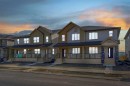 822, 826, 830, 834 Wolf Willow Boulevard Se, Calgary, AB  - Outdoor With Deck Patio Veranda With Facade 
