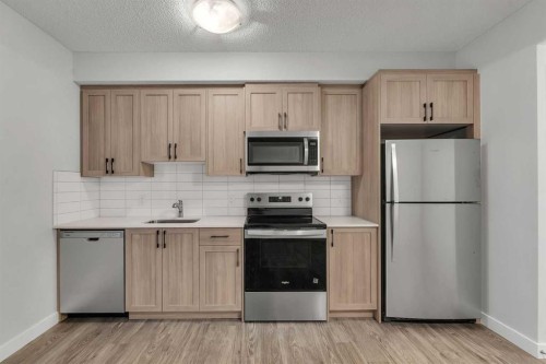 822, 826, 830, 834 Wolf Willow Boulevard Se, Calgary, AB - Indoor Photo Showing Kitchen With Stainless Steel Kitchen