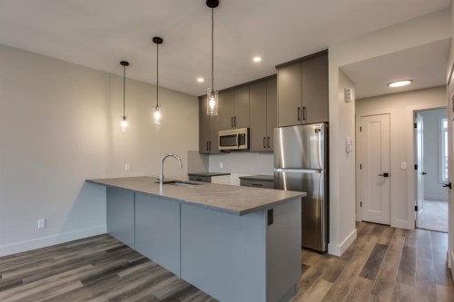 259 Royal Elm Road Nw, Calgary, AB - Indoor Photo Showing Kitchen With Double Sink With Upgraded Kitchen